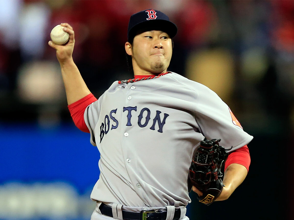 セットアッパーとしてチームの世界一に貢献した田澤純一 photo by Getty Images