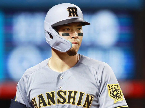 昨季、本塁打と打点の二冠に輝いた佐藤輝明　photo by Yoshihiro Koike