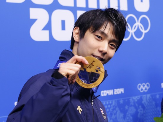 Hanyu smiling with the gold medal at the 2014 Winter Olympics in Sochi